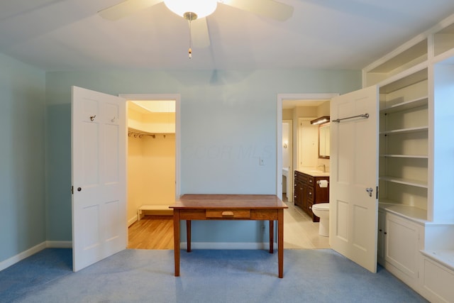 536 E Allen St, Lancaster, OH 43130 - unfurnished bedroom with a sink, a ceiling fan, ensuite bath, and light carpet