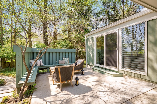 view of patio / terrace featuring fence