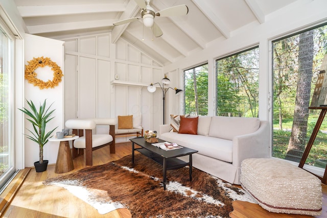 sunroom / solarium featuring wood finished floors and a healthy amount of sunlight
