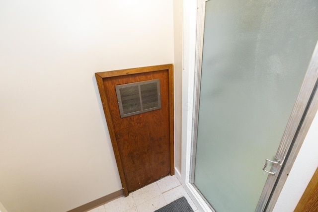 view of exterior entry featuring visible vents