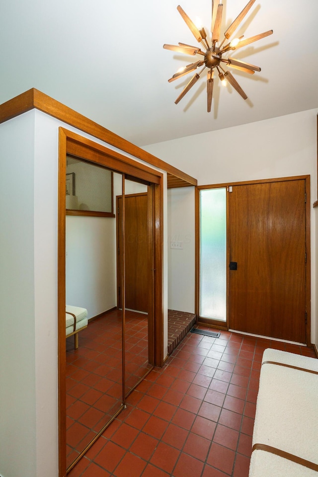 tiled entrance foyer with ceiling fan