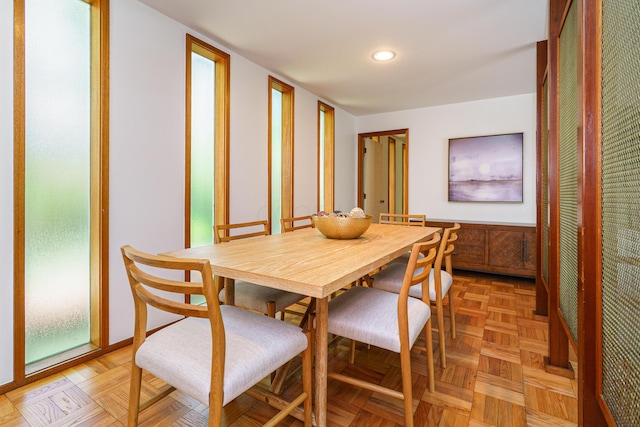 dining area featuring recessed lighting and wainscoting