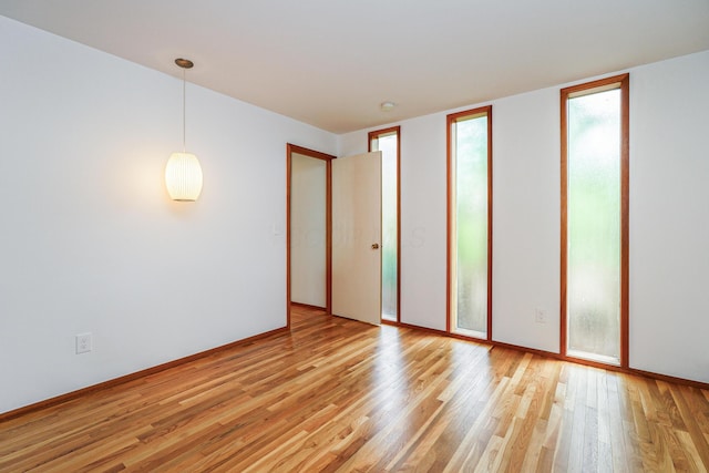 spare room featuring light wood-style flooring