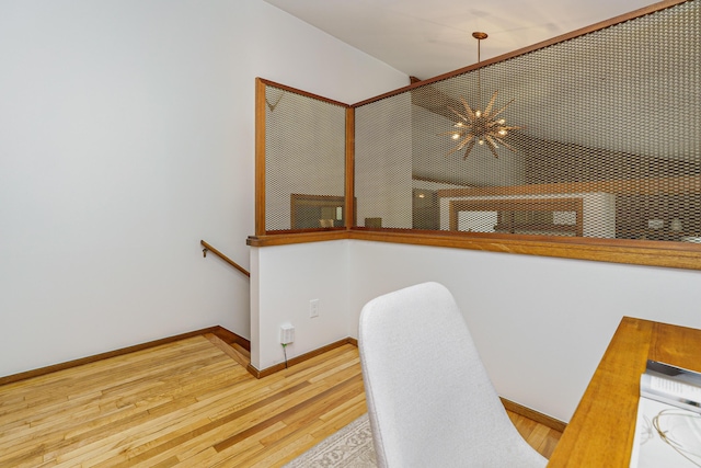 dining area featuring wood finished floors and baseboards