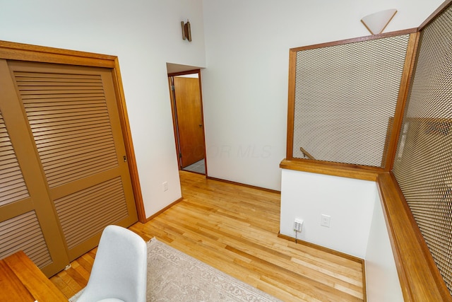 interior space featuring baseboards and light wood-style floors