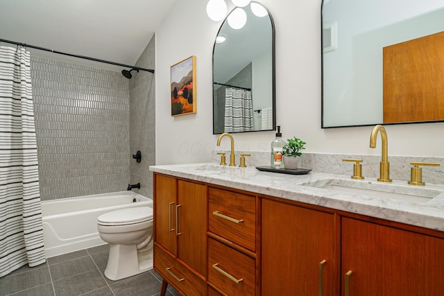 full bathroom with tile patterned floors, shower / bath combo with shower curtain, double vanity, and a sink