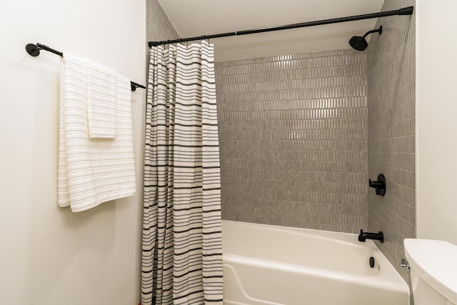 full bath with shower / tub combo and toilet