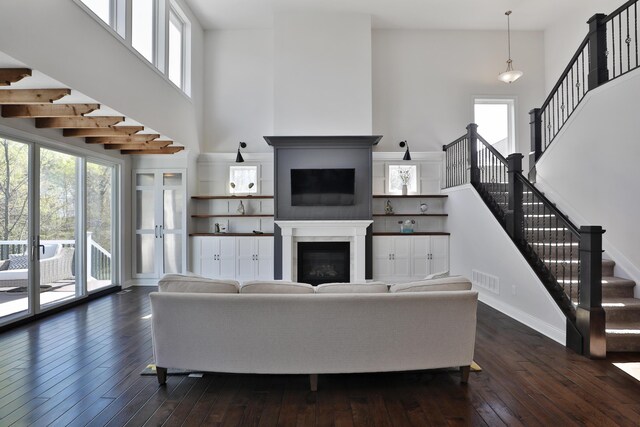 living room featuring stairs and a wealth of natural light