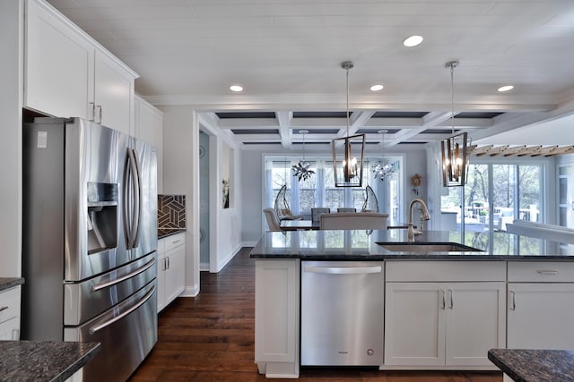 kitchen with recessed lighting, a healthy amount of sunlight, appliances with stainless steel finishes, and a sink