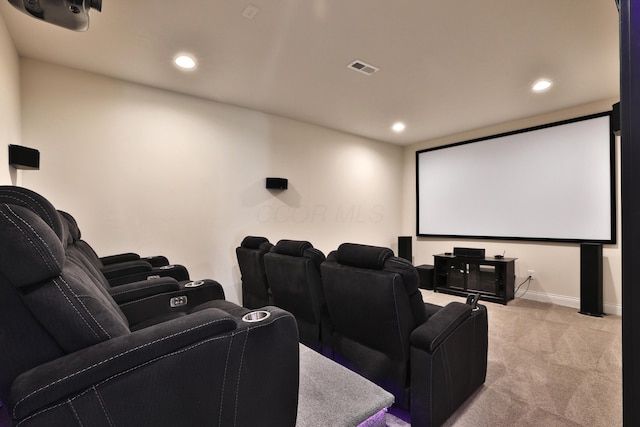 cinema room featuring baseboards, recessed lighting, visible vents, and light carpet