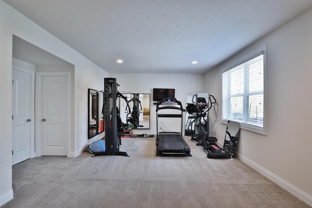 workout area with baseboards, recessed lighting, and carpet floors