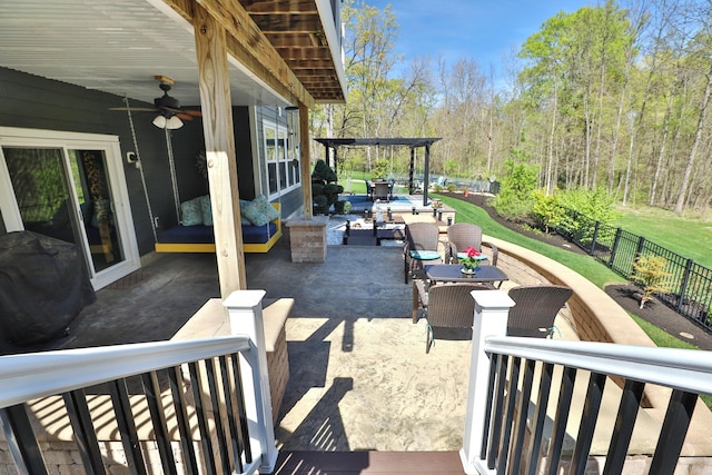 view of patio featuring fence private yard, ceiling fan, and a pergola