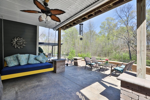 view of patio with outdoor lounge area and a ceiling fan