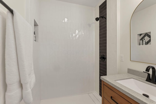 1719 Oak St, Columbus, OH 43205 - bathroom featuring vanity and a tile shower