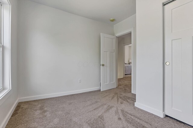 1719 Oak St, Columbus, OH 43205 - unfurnished bedroom with baseboards and carpet