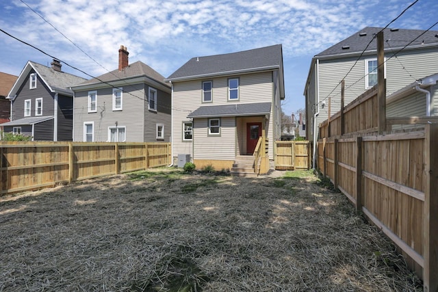 1719 Oak St, Columbus, OH 43205 - back of property with a fenced backyard, central AC unit, and entry steps