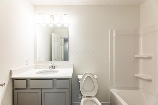 325 Woods Edge Loop, Pataskala, OH 43062 - bathroom with toilet, vanity, and bathtub / shower combination
