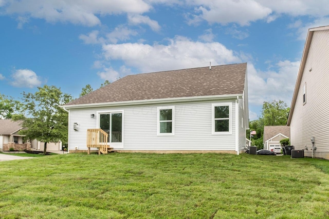 325 Woods Edge Loop, Pataskala, OH 43062 - back of house with entry steps, central AC, a yard, and a shingled roof