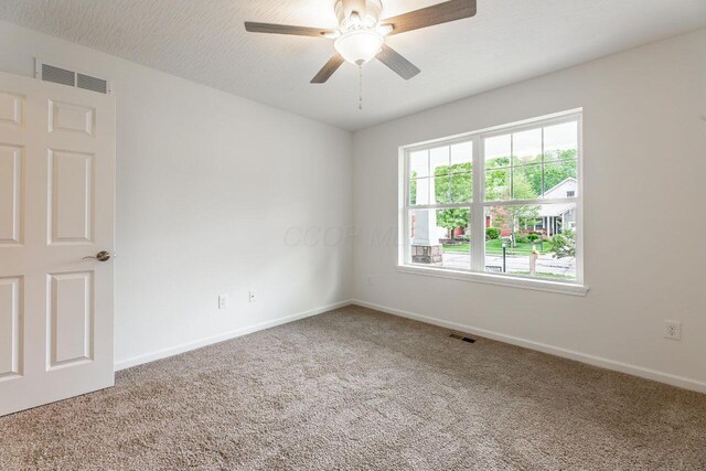 325 Woods Edge Loop, Pataskala, OH 43062 - carpeted empty room featuring a ceiling fan and baseboards