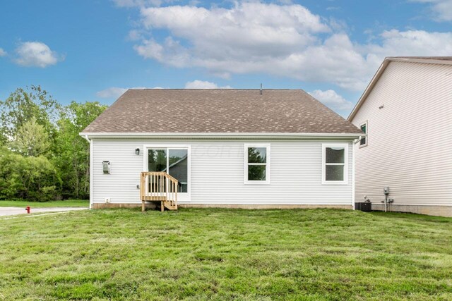 325 Woods Edge Loop, Pataskala, OH 43062 - back of property with a lawn and roof with shingles
