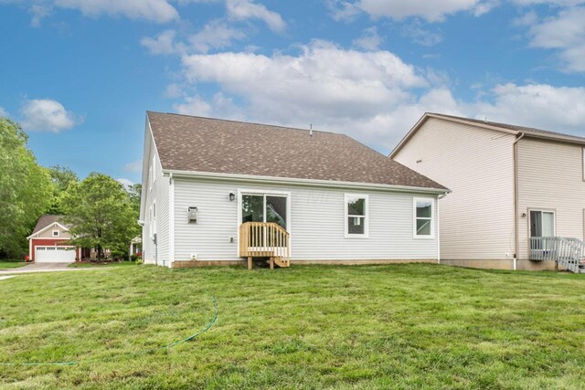 325 Woods Edge Loop, Pataskala, OH 43062 - back of property with a lawn and roof with shingles