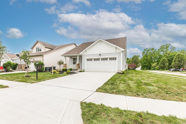 325 Woods Edge Loop, Pataskala, OH 43062 - view of front of property with a garage, a front yard, and concrete driveway