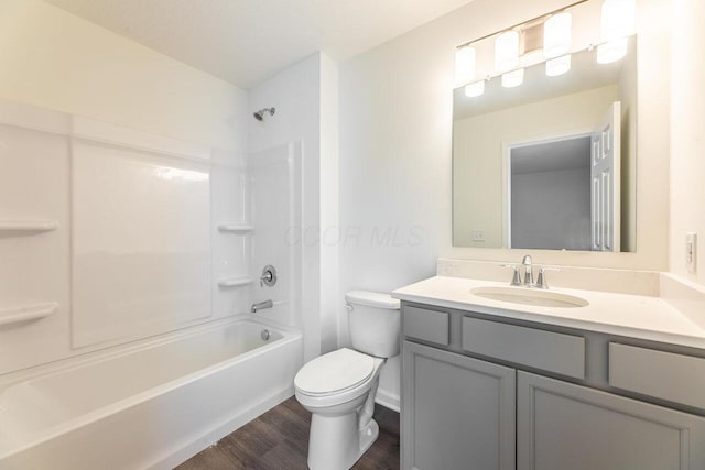 325 Woods Edge Loop, Pataskala, OH 43062 - bathroom with toilet, vanity, wood finished floors, washtub / shower combination, and baseboards