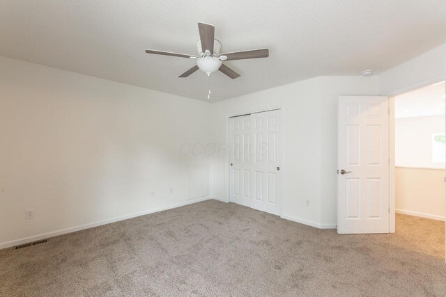 325 Woods Edge Loop, Pataskala, OH 43062 - unfurnished bedroom featuring carpet floors, baseboards, a closet, and a ceiling fan