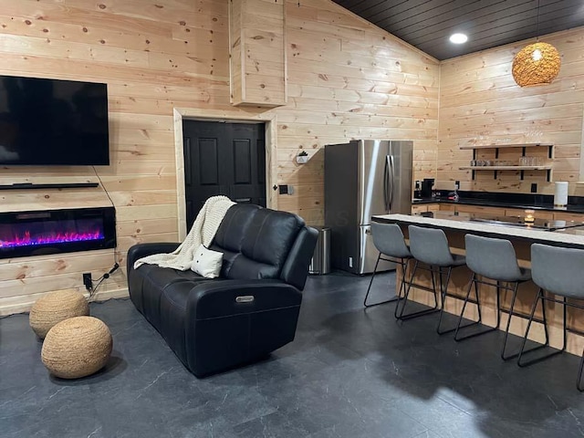 living room featuring finished concrete floors, wood walls, wood ceiling, and lofted ceiling