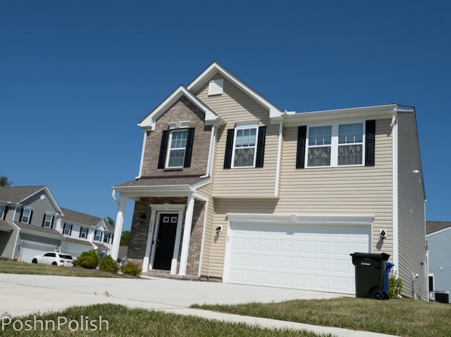 5938 Bears Run Rd, Columbus, OH 43232 - view of front facade with a garage, concrete driveway, and brick siding