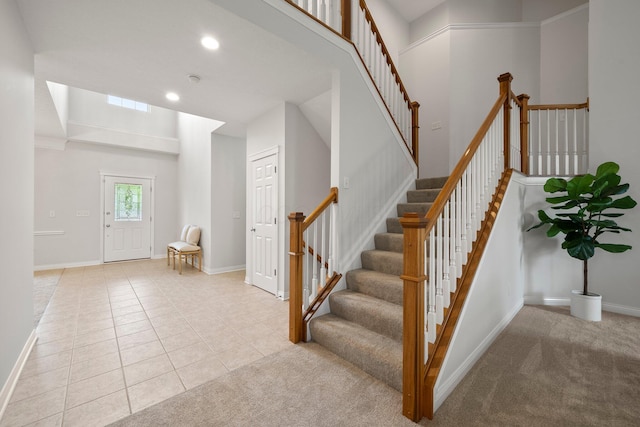 staircase featuring recessed lighting, visible vents, tile patterned floors, and baseboards