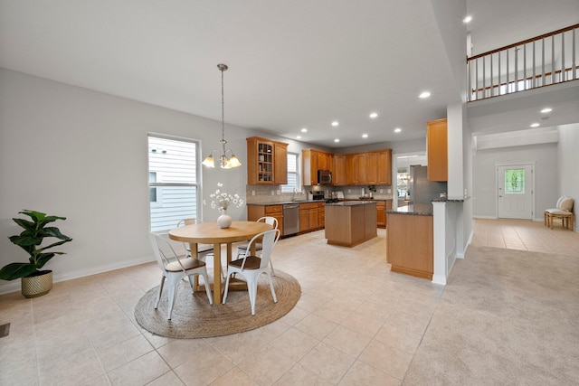 dining space featuring light tile patterned flooring, a chandelier, baseboards, and recessed lighting