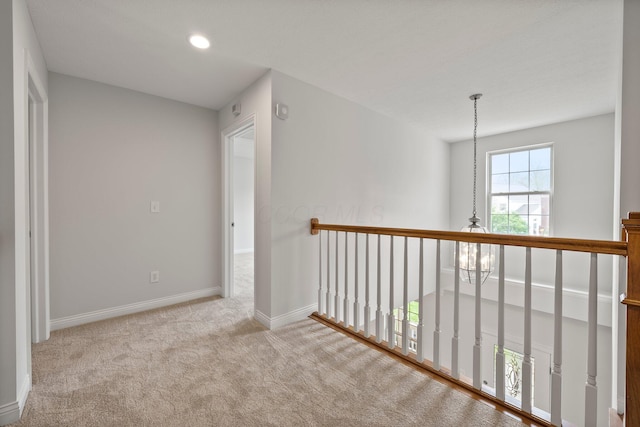 corridor with baseboards, carpet, and recessed lighting