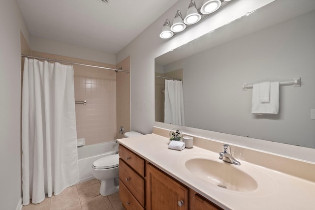 full bathroom featuring shower / tub combo with curtain, tile patterned floors, vanity, and toilet