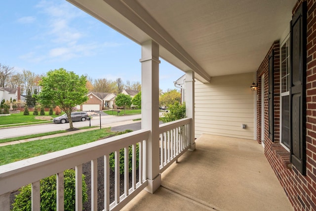 balcony featuring a porch and a residential view