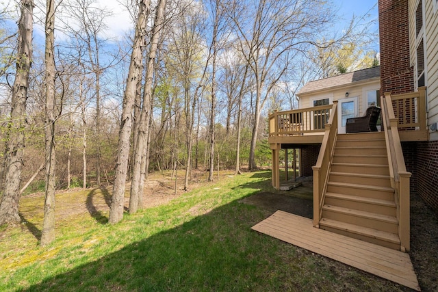 view of yard with stairway and a deck