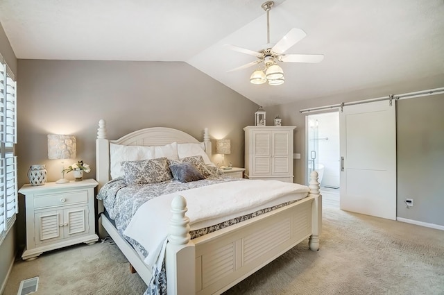 bedroom with a barn door, a ceiling fan, light carpet, lofted ceiling, and visible vents