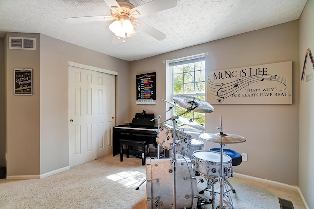 playroom featuring baseboards, visible vents, carpet flooring, and ceiling fan