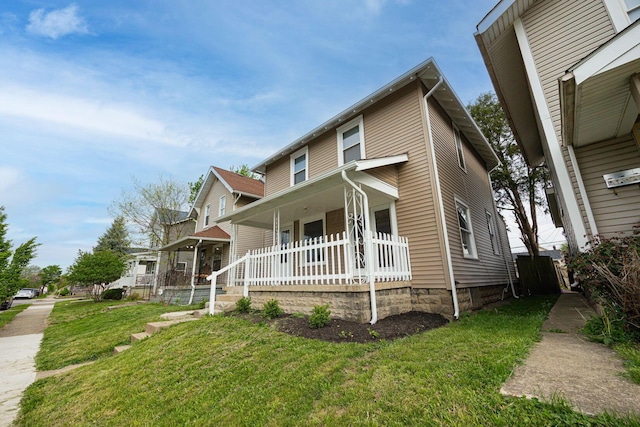 196 E Woodrow Ave, Columbus, OH 43207 - view of front facade with a porch and a front lawn