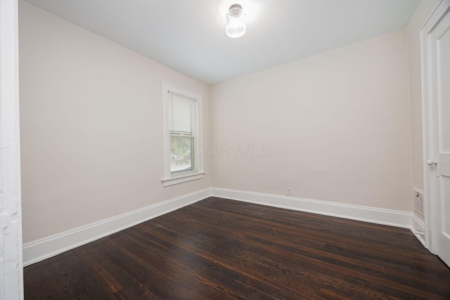 196 E Woodrow Ave, Columbus, OH 43207 - unfurnished room featuring dark wood-style floors and baseboards