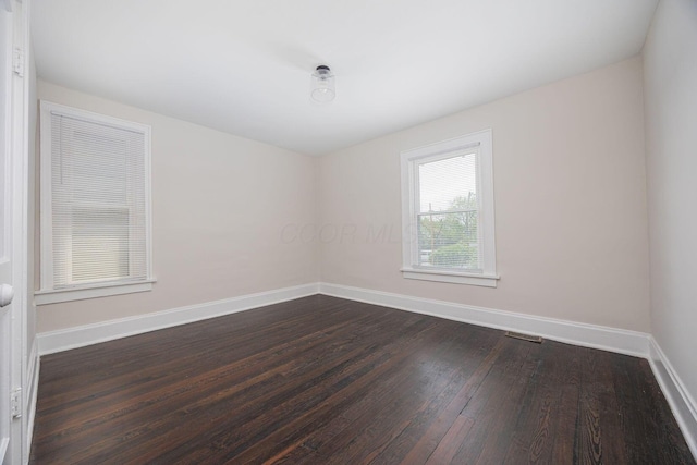 196 E Woodrow Ave, Columbus, OH 43207 - empty room featuring dark wood-style flooring and baseboards