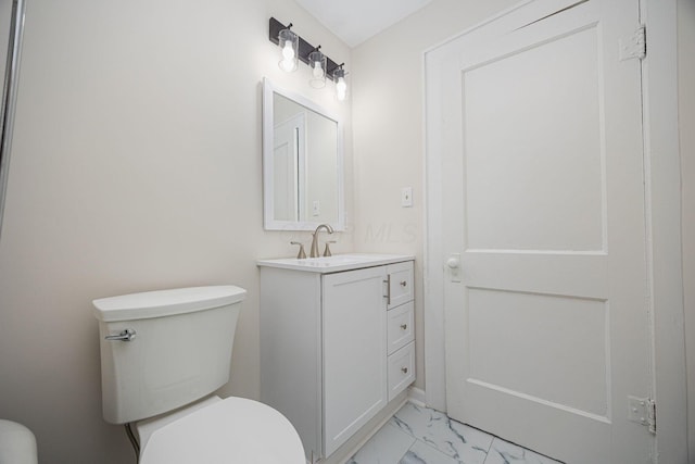 196 E Woodrow Ave, Columbus, OH 43207 - bathroom with toilet, marble look tile flooring, and vanity