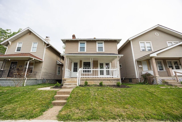 196 E Woodrow Ave, Columbus, OH 43207 - traditional style home with a porch, a front lawn, and a chimney