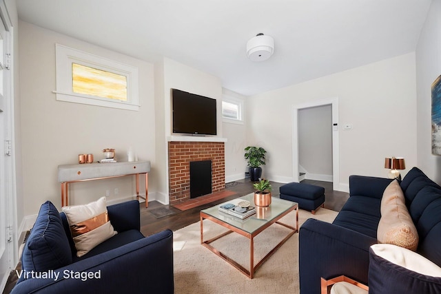 196 E Woodrow Ave, Columbus, OH 43207 - living room with wood finished floors, a fireplace, and baseboards