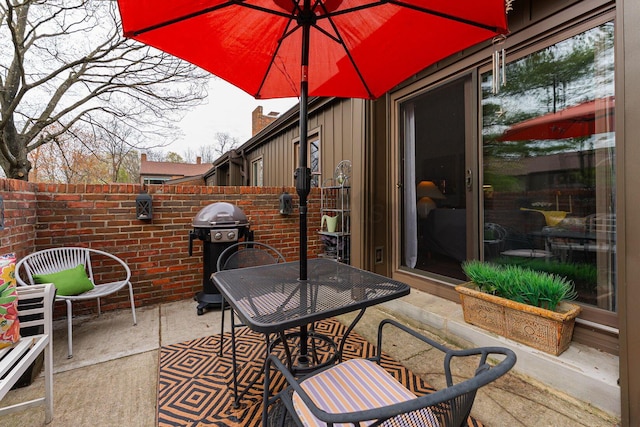 91 Glen Dr, Worthington, OH 43085 - view of patio featuring outdoor dining area, a grill, and fence