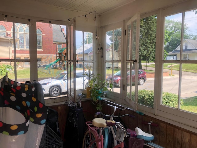 sunroom featuring wood ceiling