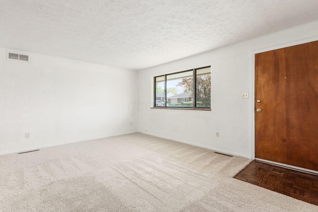 6350 Roselawn Ave, Reynoldsburg, OH 43068 - spare room with a textured ceiling, carpet floors, visible vents, and baseboards