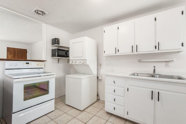 6350 Roselawn Ave, Reynoldsburg, OH 43068 - kitchen featuring white range with electric cooktop, a sink, black microwave, stacked washer and dryer, and visible vents