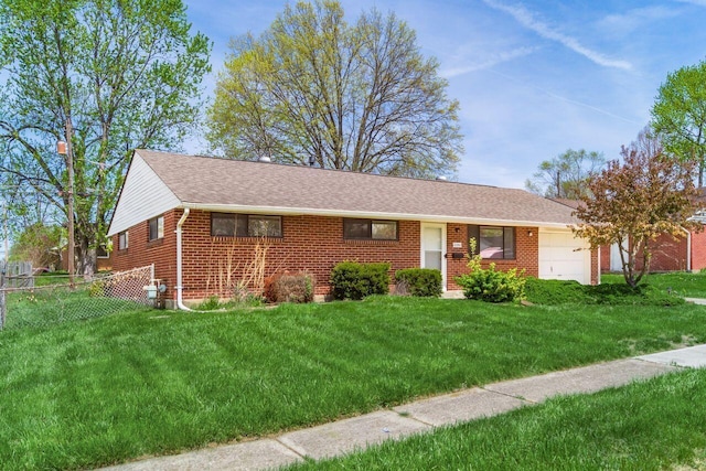 6350 Roselawn Ave, Reynoldsburg, OH 43068 - single story home with brick siding, a front lawn, a garage, and fence