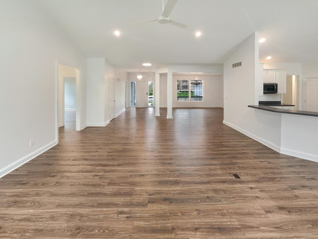 unfurnished living room with visible vents, recessed lighting, ceiling fan, and dark wood finished floors